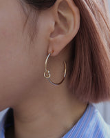 knot hoop pierce