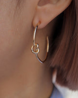 knot hoop pierce