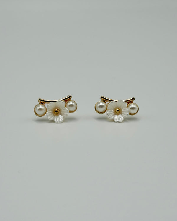 between flower pierce & earring