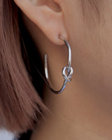 knot hoop pierce