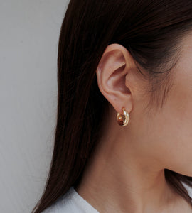 shiny cross hoop pierce