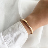 melty triangle bangle