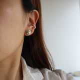 holding pearl pierce