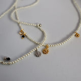 pearl & charm necklace