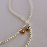 pearl & charm necklace