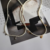 pearl & charm necklace