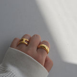 greasy shiny ring